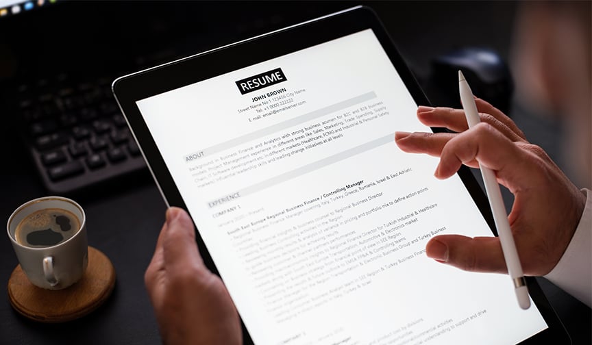 A resume appears on a tablet